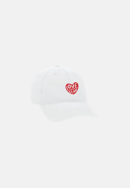 White Love Over Fear Dad Hat sold by Seek Discomfort