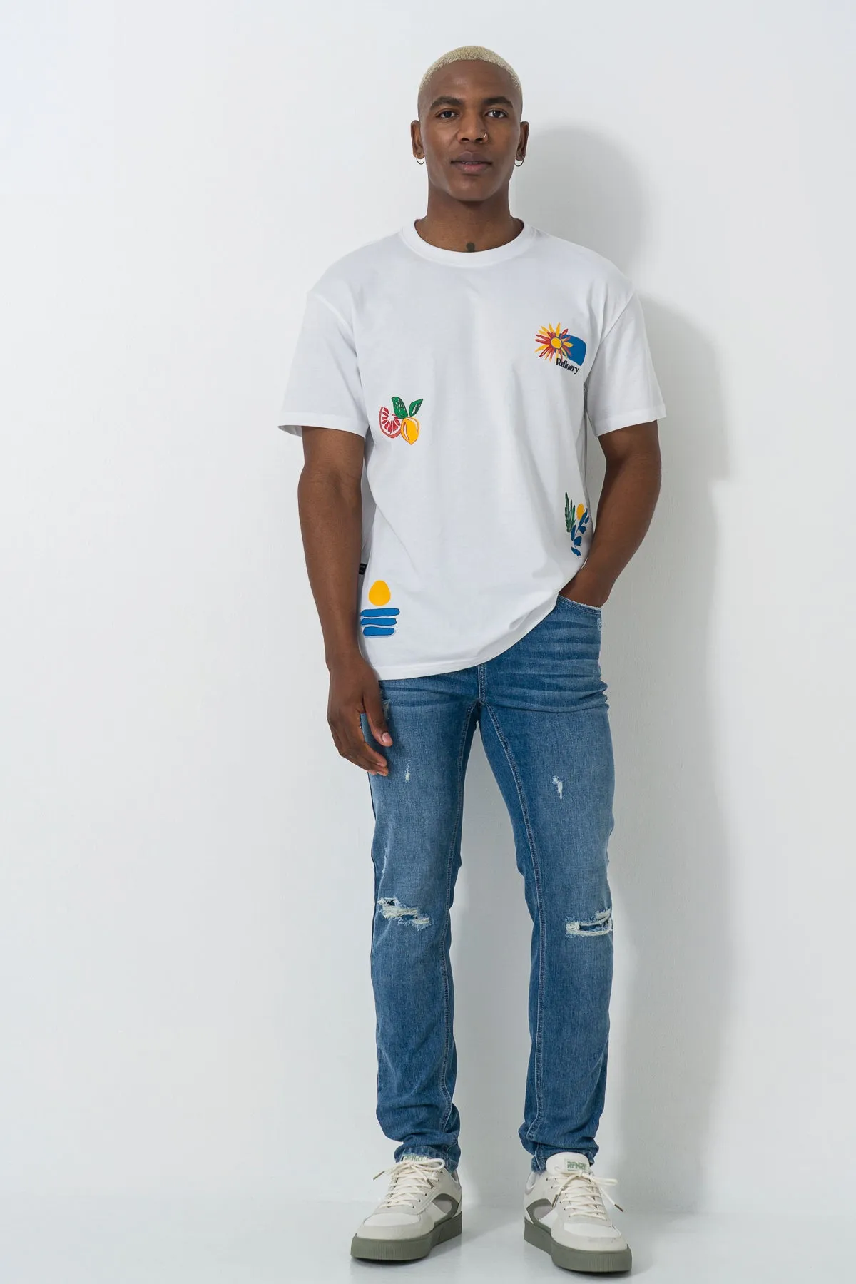 Mid Wash Skinny Jeans sold by Refinery