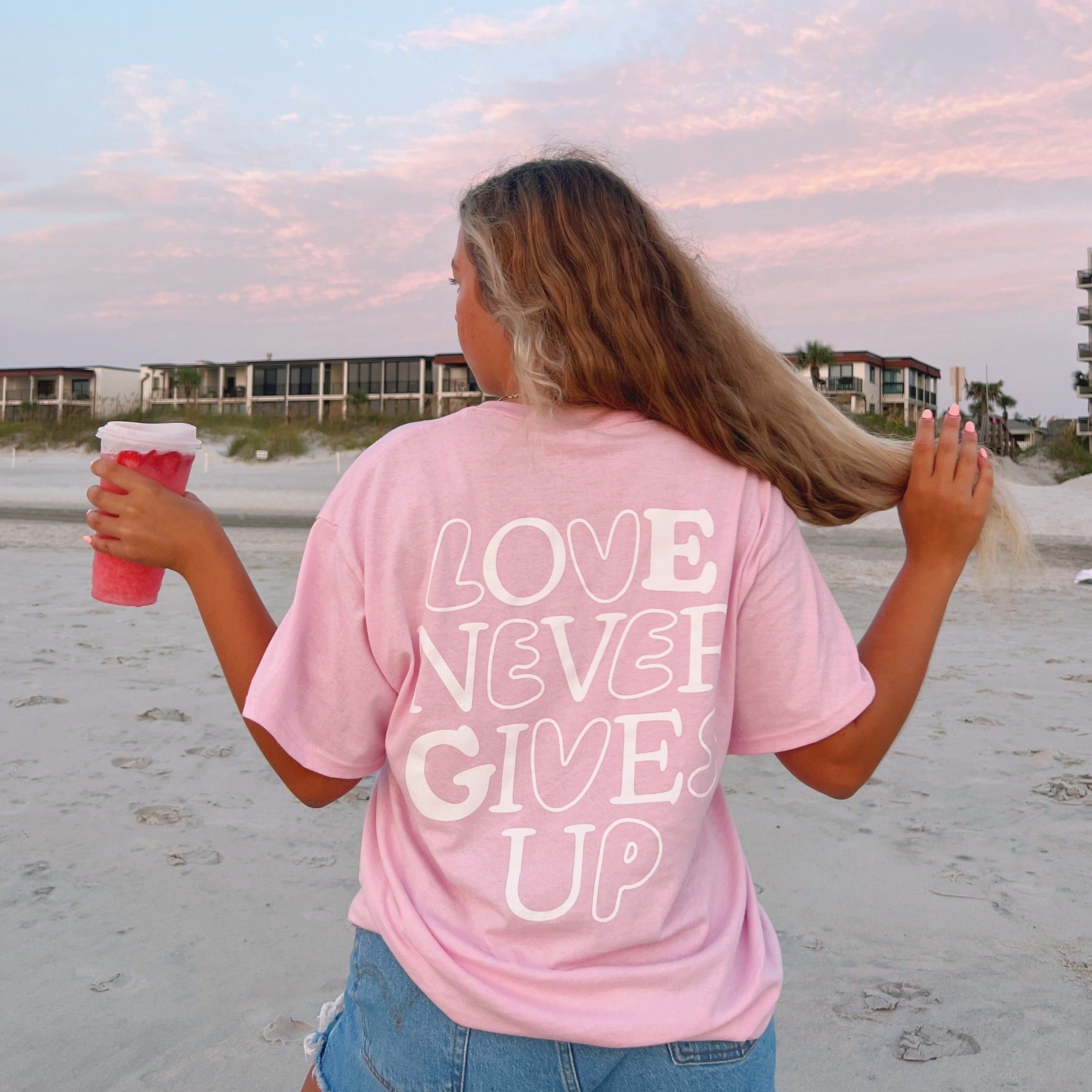 NEW! | "LOVE NEVER GIVES UP" BUBBLE TEE | PINK sold by He Would Love First