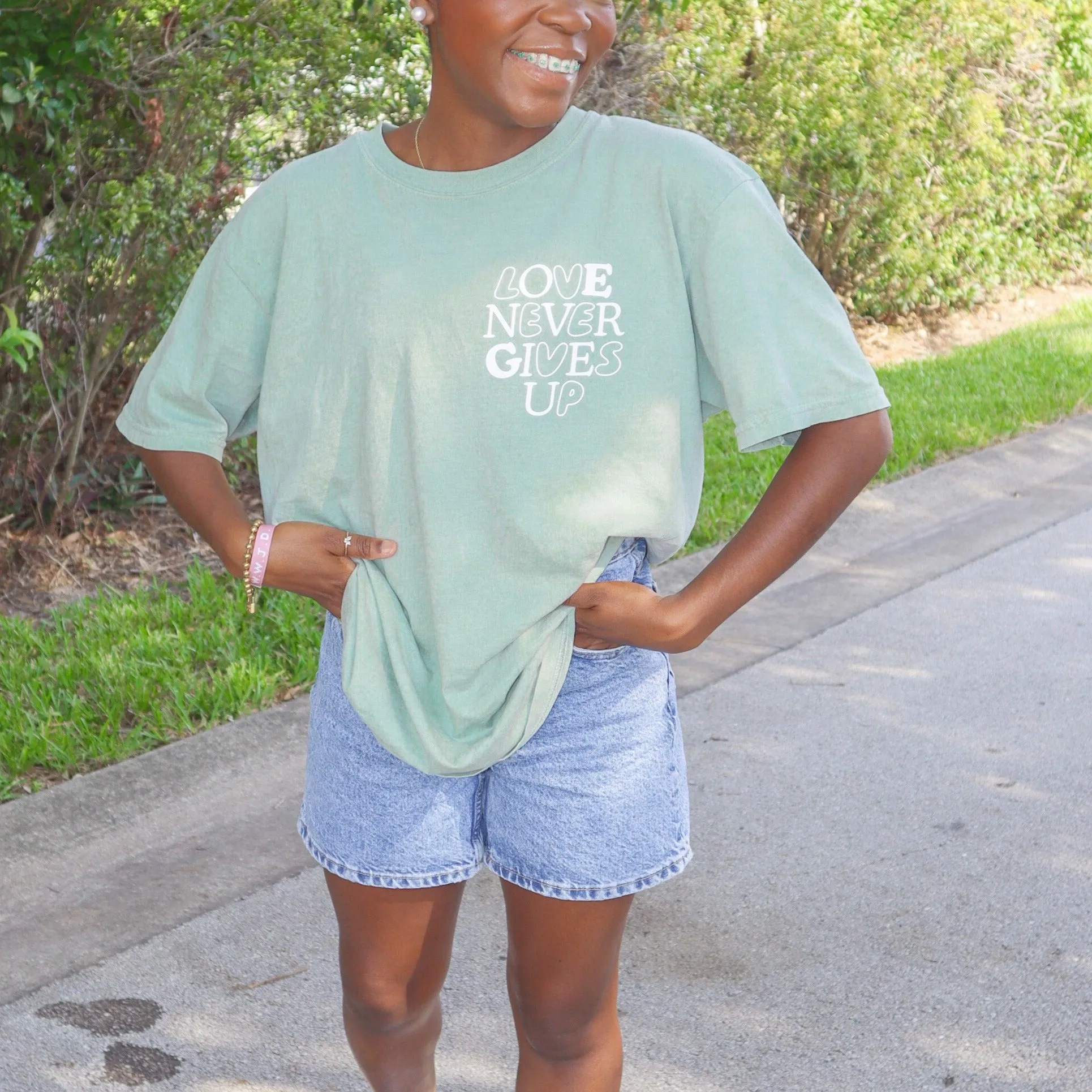 NEW! | "LOVE NEVER GIVES UP" PREMIUM COMFORT COLOR TEE | BAY sold by He Would Love First product image thumbnail 4