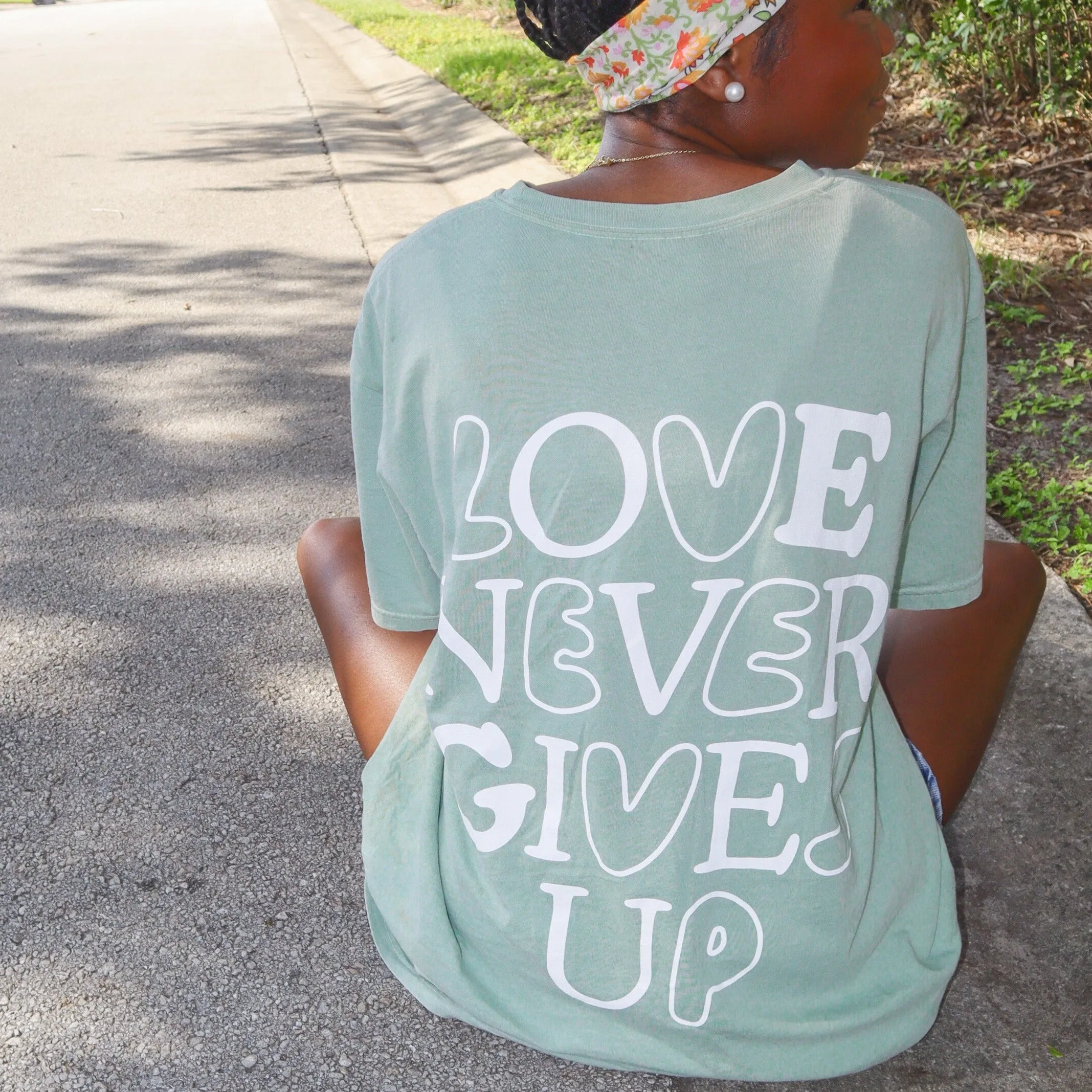NEW! | "LOVE NEVER GIVES UP" PREMIUM COMFORT COLOR TEE | BAY sold by He Would Love First product image thumbnail 3