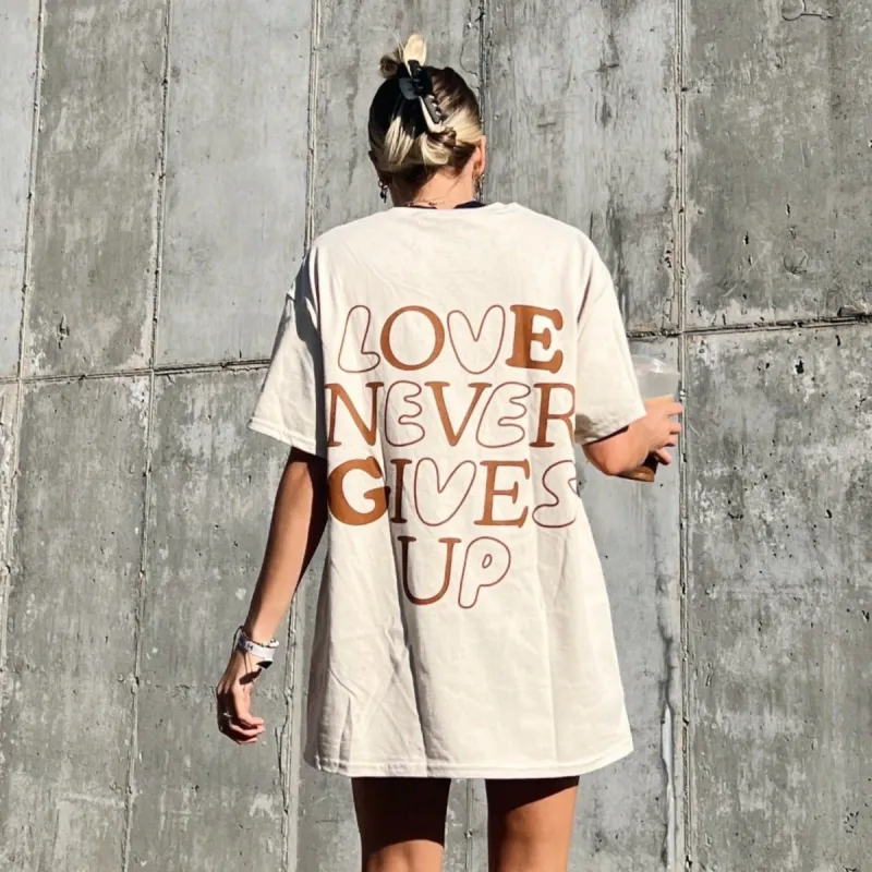 LIMITED RESTOCK! | "LOVE NEVER GIVES UP" BUBBLE TEE | SAND sold by He Would Love First