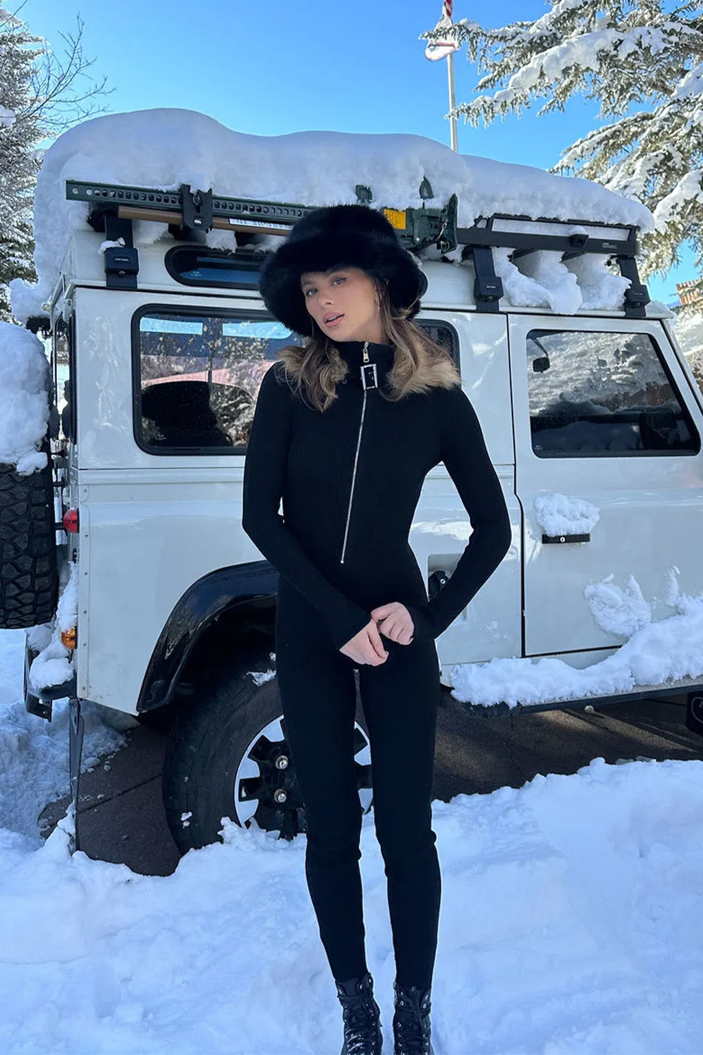 Apres Faux Fur Trimmed Black Ribbed Knit Jumpsuit sold by 12th Tribe