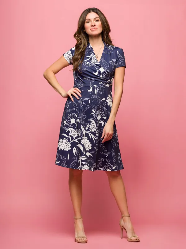 24seven Comfort Apparel Womens Navy Print Short Sleeve Knee Length V Neck Wrap Dress sold by 24/7 Comfort Apparel