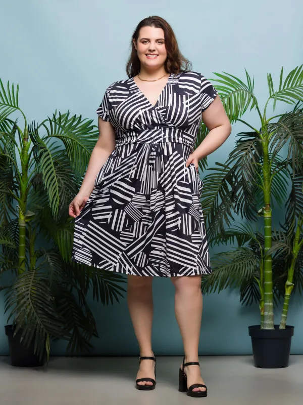 24seven Comfort Apparel Plus Size Cap Sleeve Black and White V Neck Knee Length Pocket Dress sold by 24/7 Comfort Apparel