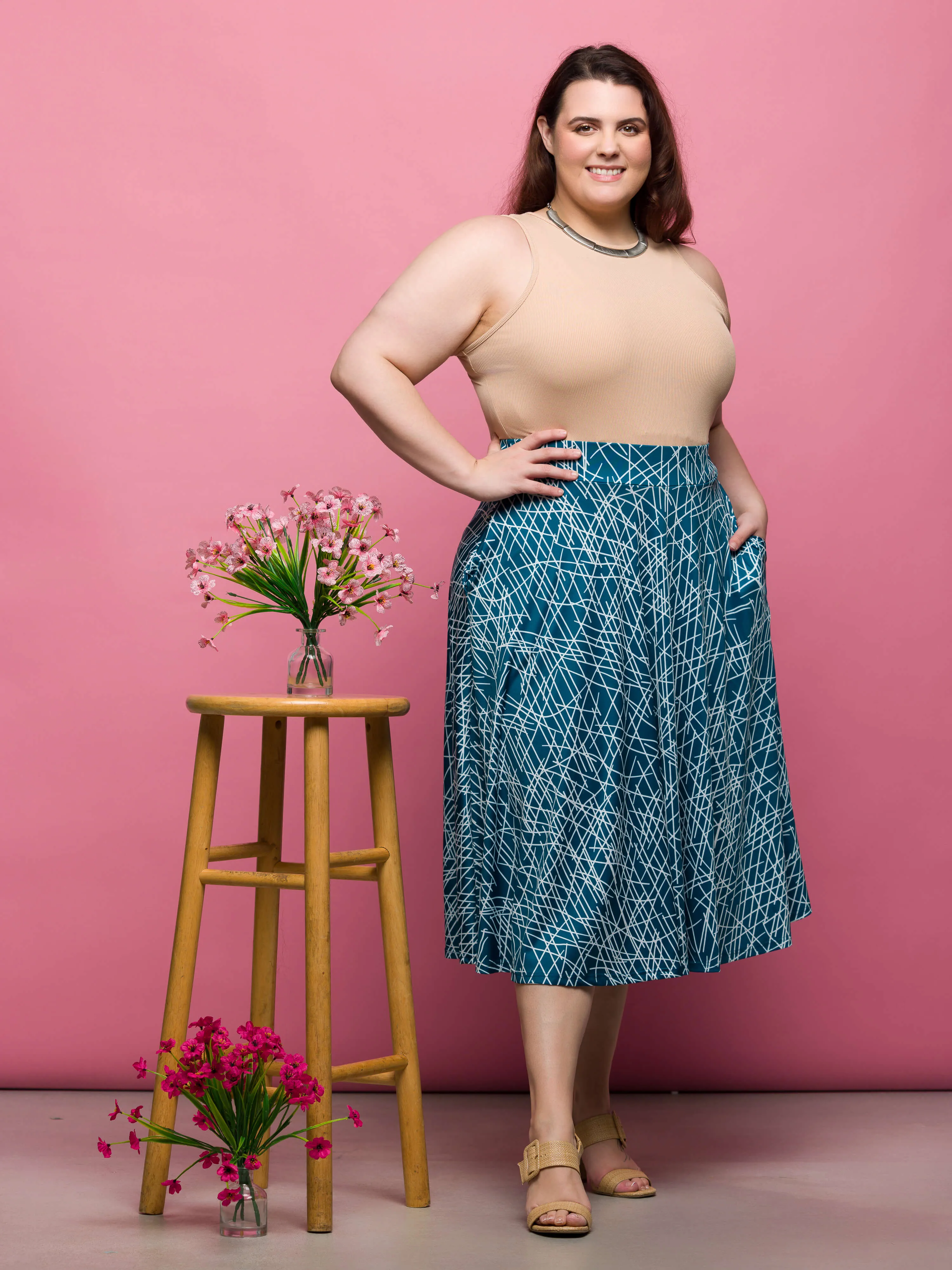 24seven Comfort Apparel Plus Size Teal Geometric Print Elastic Waist Pocket Midi Skirt sold by 24/7 Comfort Apparel