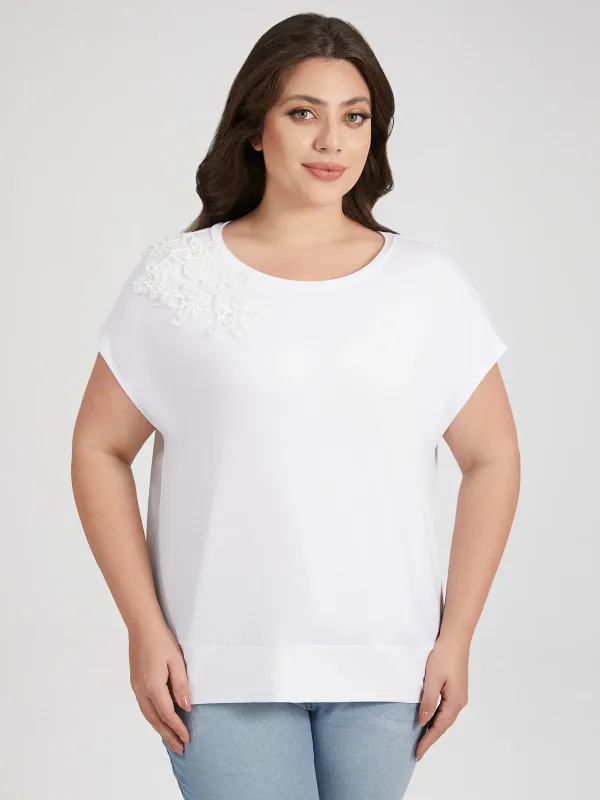 Plus Floral Embellishment Dolman Top sold by 89th & Madison