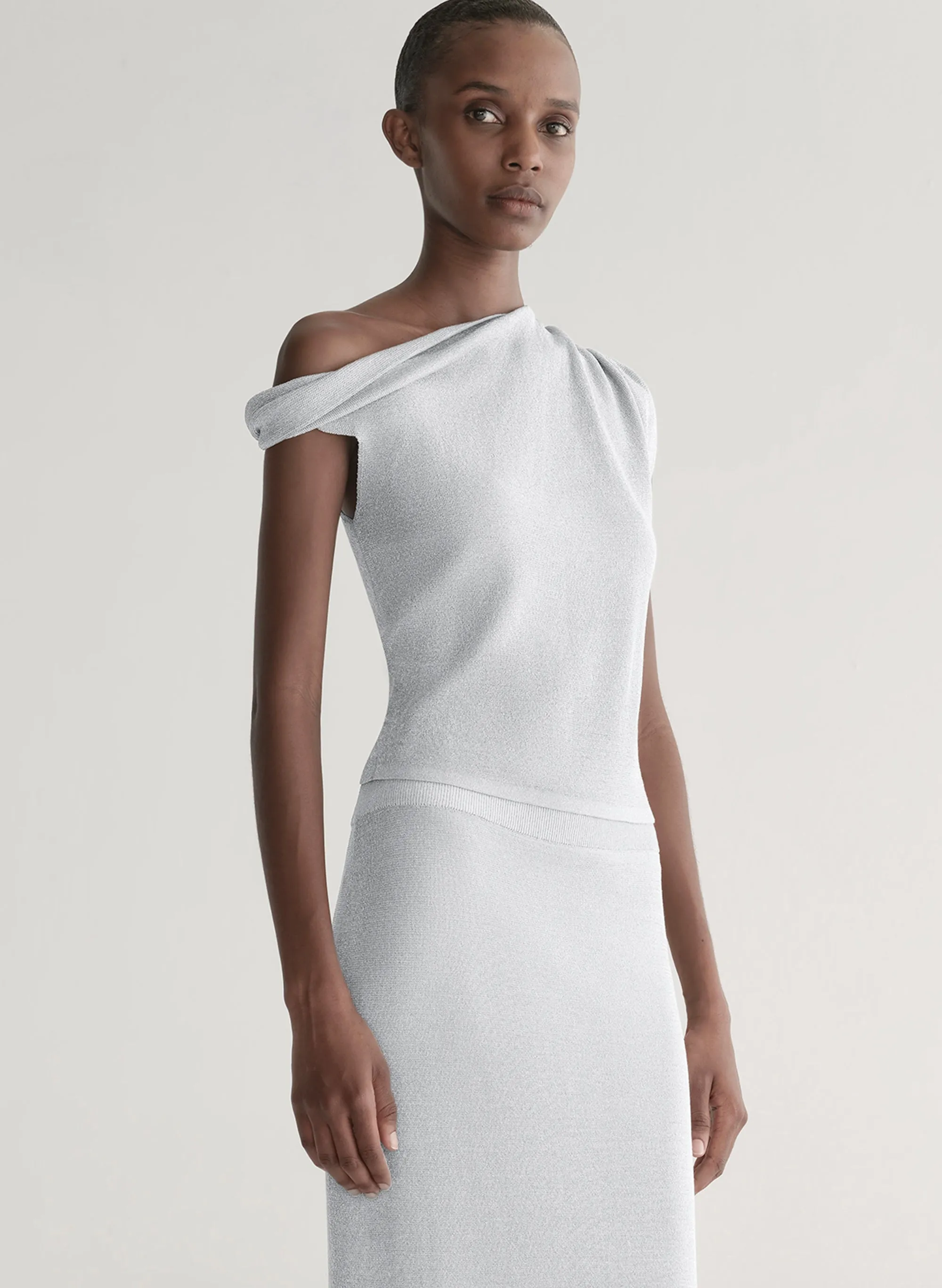 Mona Metallic Knit Asymmetric Top sold by A.L.C.