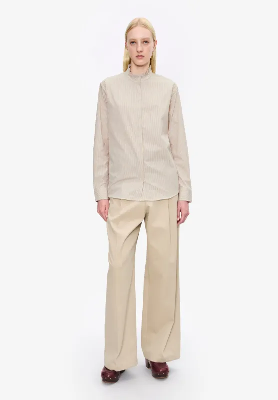 Striped blouse with ruffled collar sold by A.P.C.