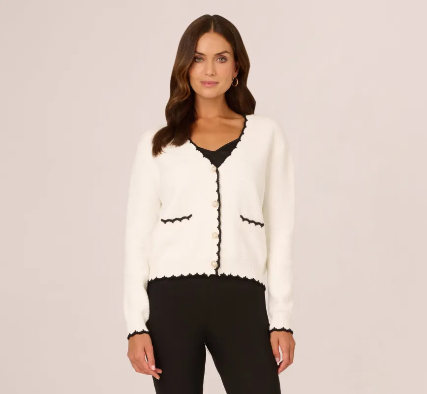Cardigan Sweater With Contrast Scallop Trim In Ivory Black made by Adrianna Papell
