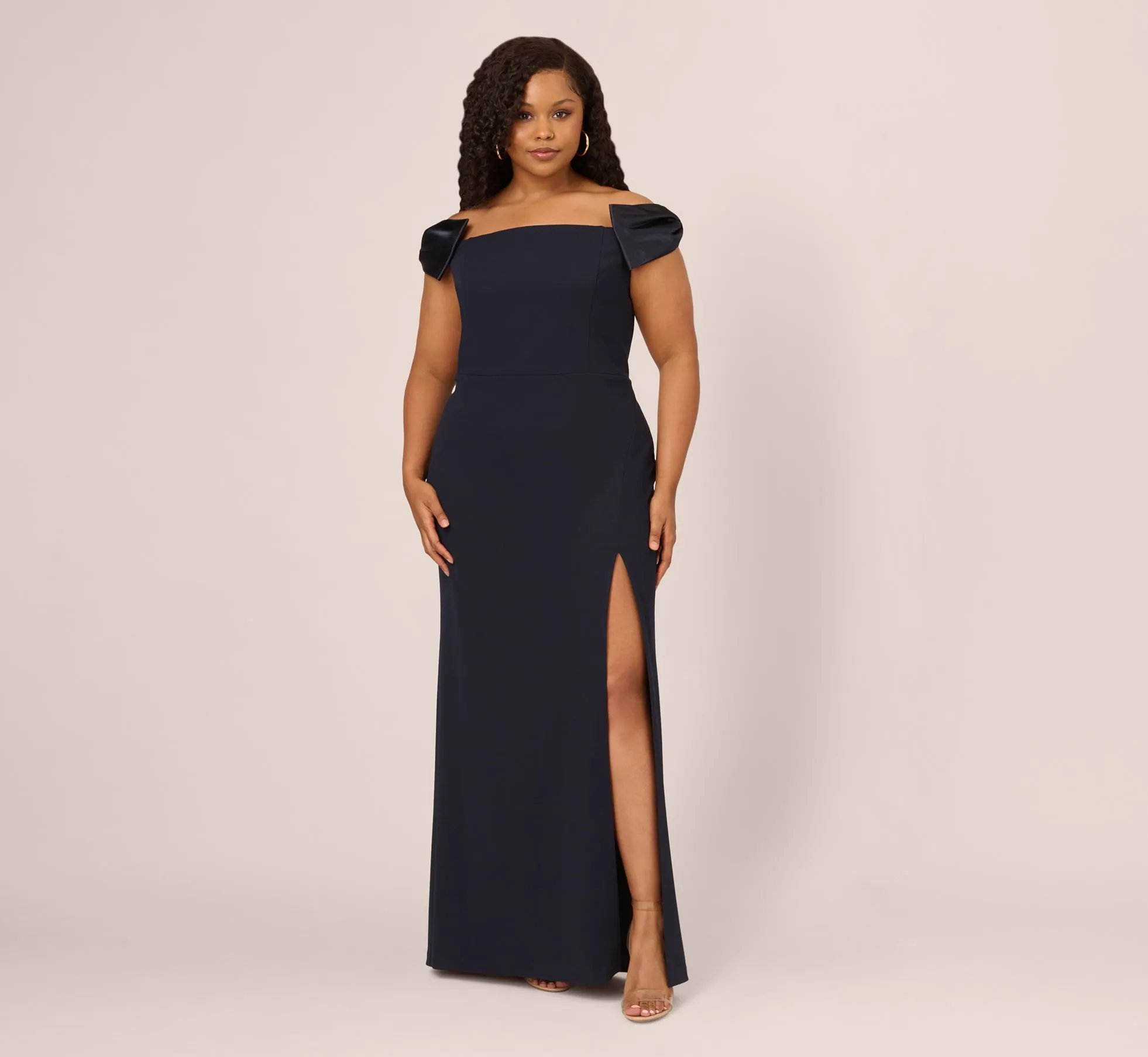 Plus Size Off The Shoulder Crepe Column Gown With Bow Accents In Twilight sold by Adrianna Papell