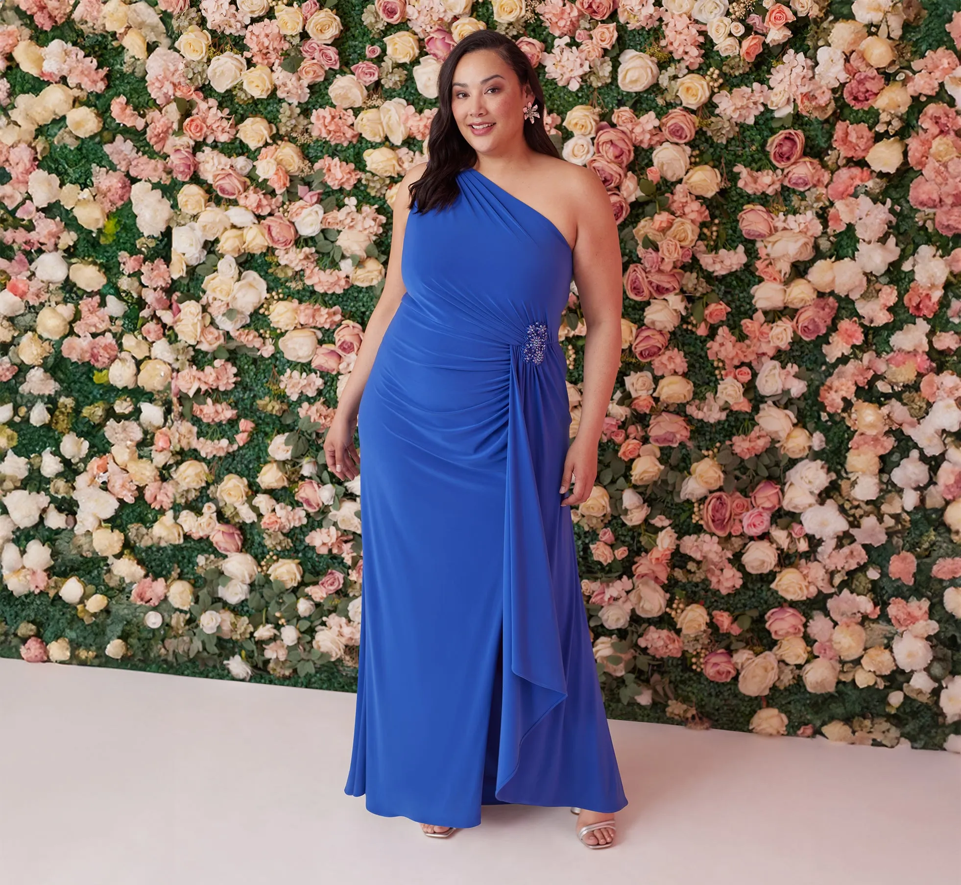 Plus Size One Shoulder Draped Jersey Gown With Floral Sequin Accents In Brilliant Sapphire sold by Adrianna Papell