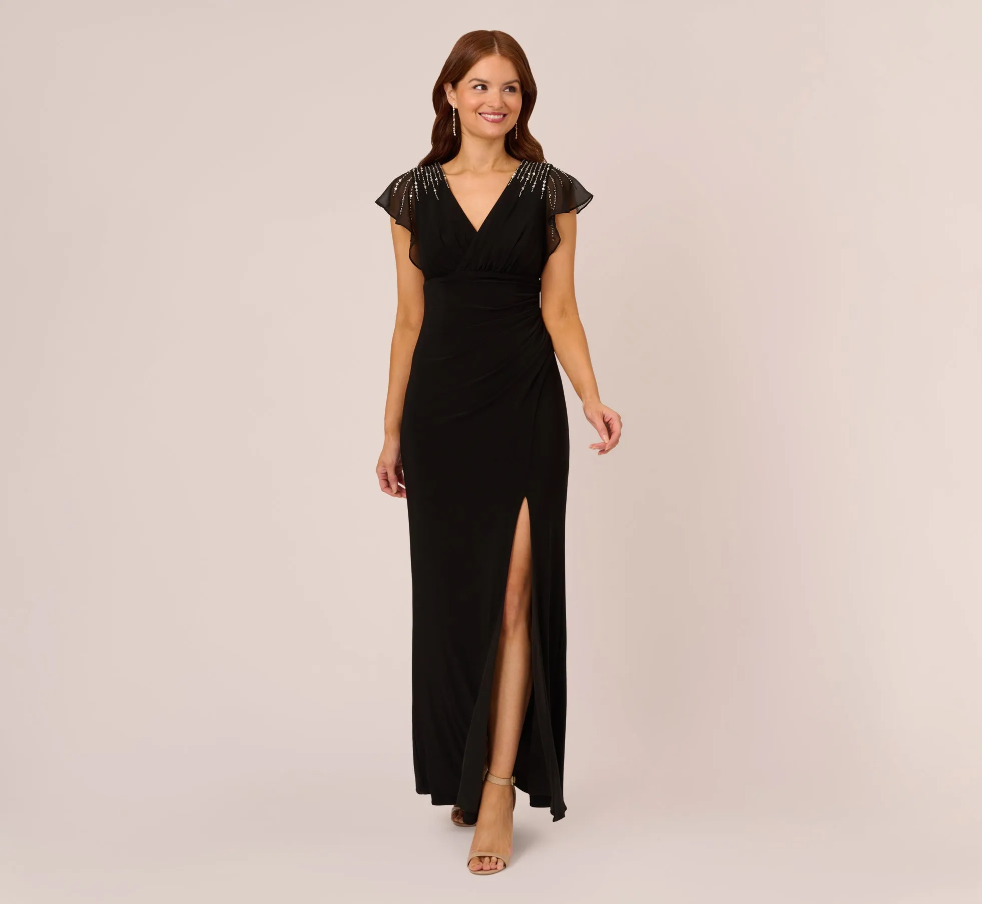 Flutter Sleeve Mermaid Gown With Beaded Details In Black sold by Adrianna Papell