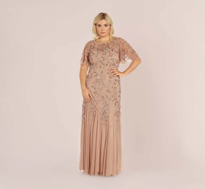 Plus Size Long Floral Beaded Gown With Flutter Sleeves In Rose Gold sold by Adrianna Papell