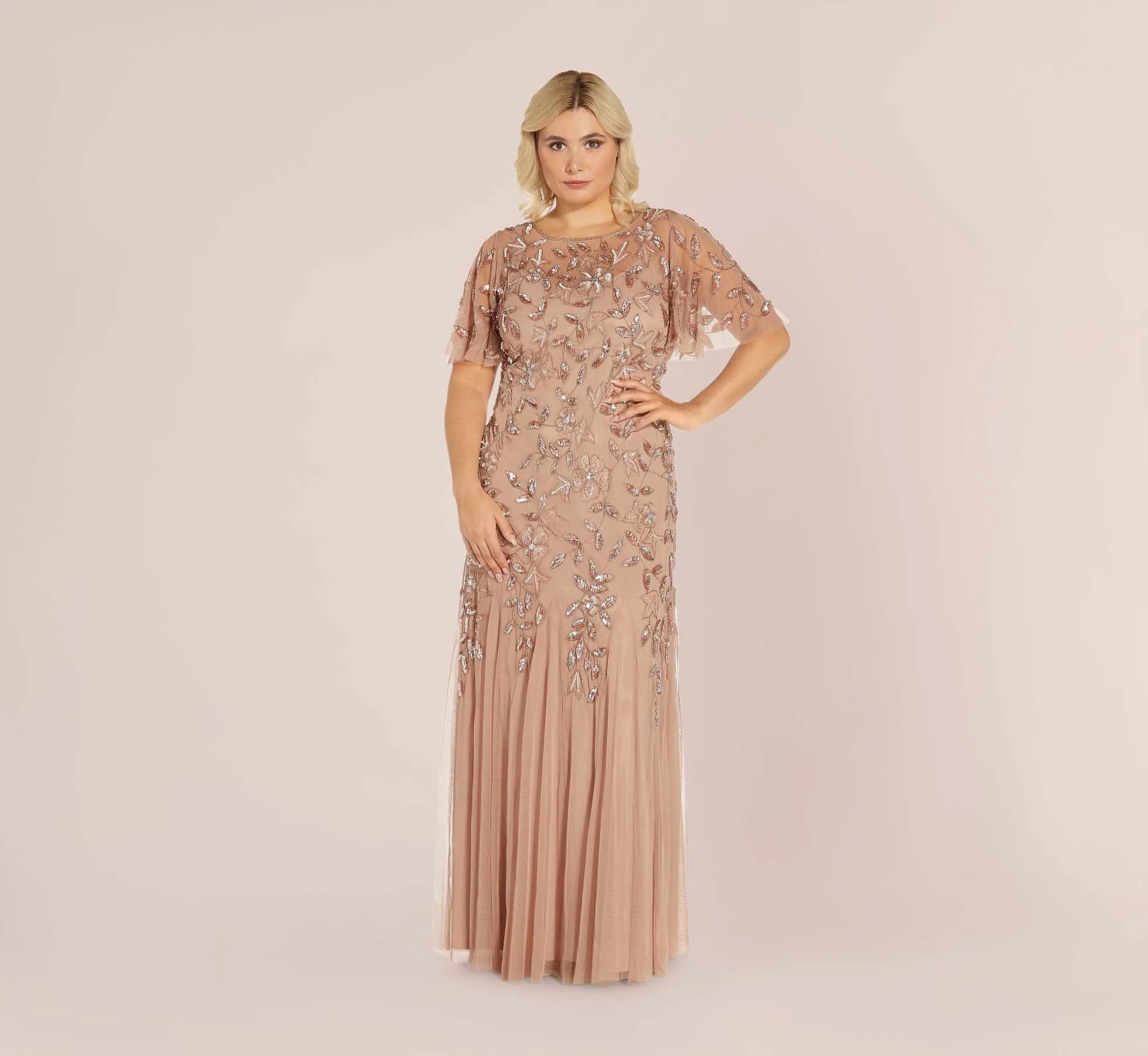 Plus Size Long Floral Beaded Gown With Flutter Sleeves In Rose Gold sold by Adrianna Papell