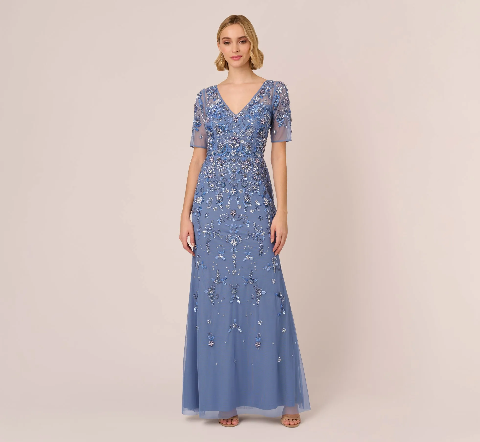 3D Floral Beaded Mermaid Gown With Sheer Short Sleeves In French Blue sold by Adrianna Papell