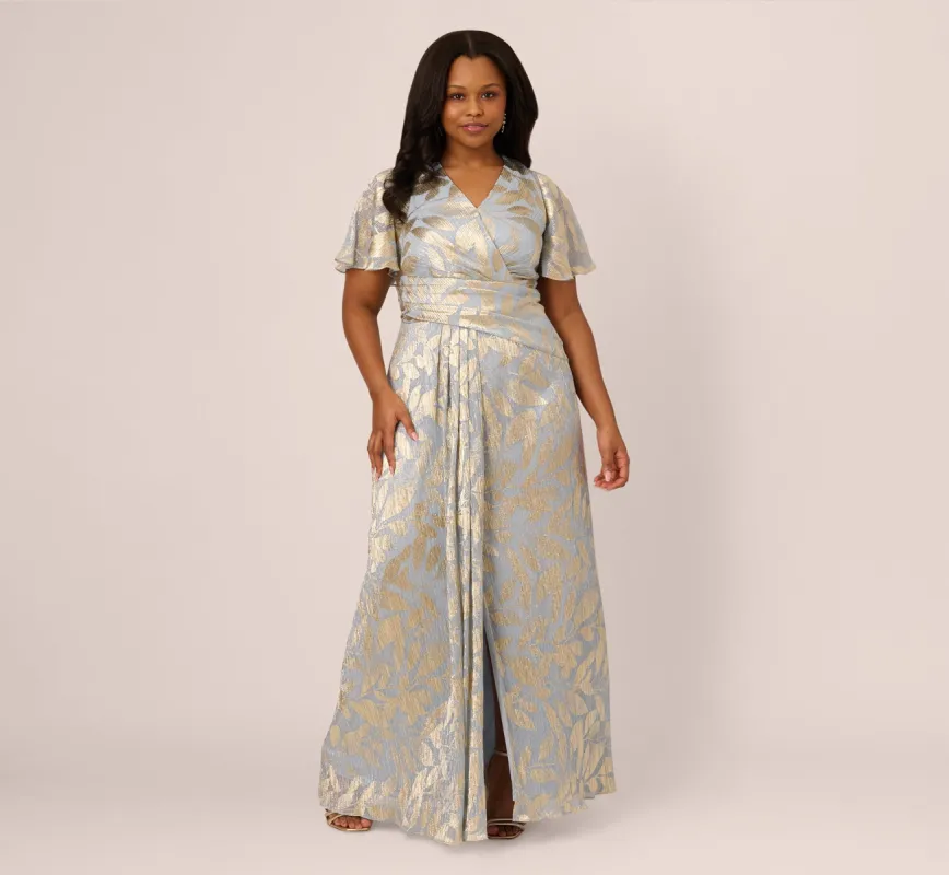 Plus Size Foil Leaf Short Sleeve Gown With Draped Details In Light Blue Gold sold by Adrianna Papell