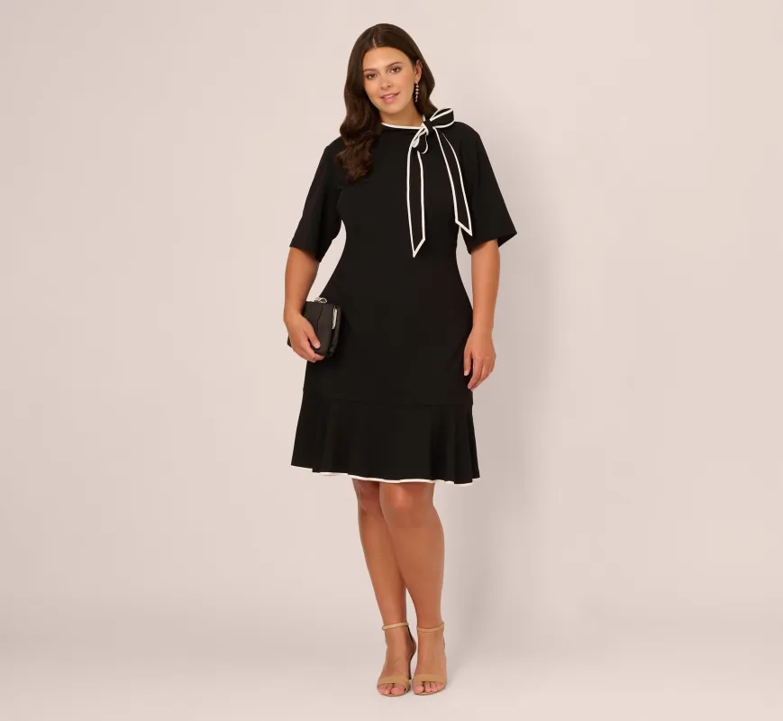 Plus Size Mock Neck Dress With Contrasting Bowtie In Black Ivory sold by Adrianna Papell