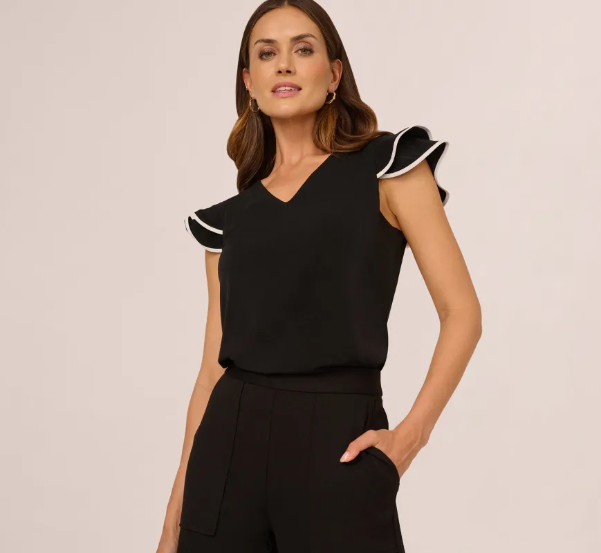 Flutter Sleeve Contrast Tipped Top In Black Ivory sold by Adrianna Papell