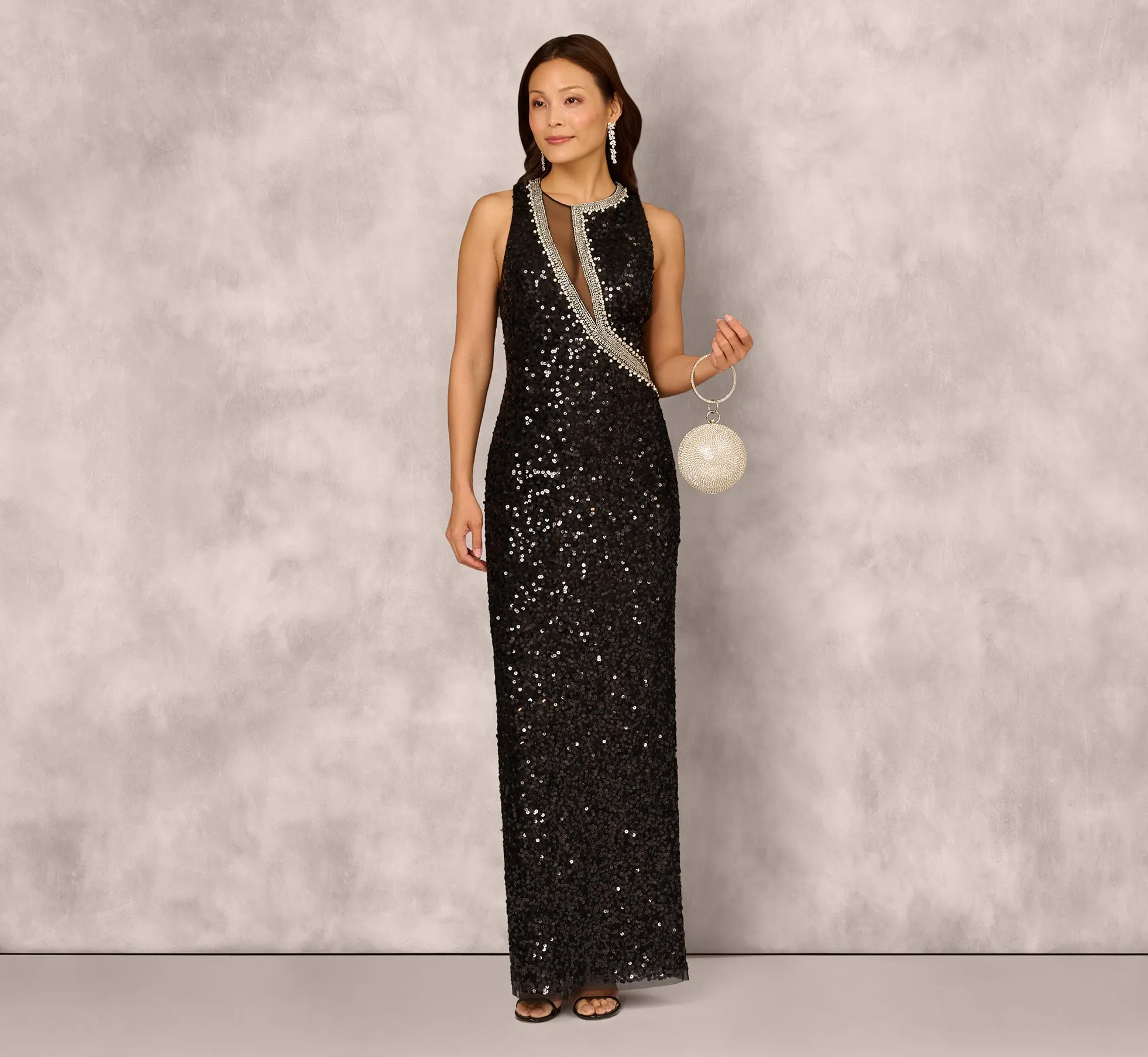 Sleeveless Asymmetrical Illusion Sequin Gown In Black sold by Adrianna Papell
