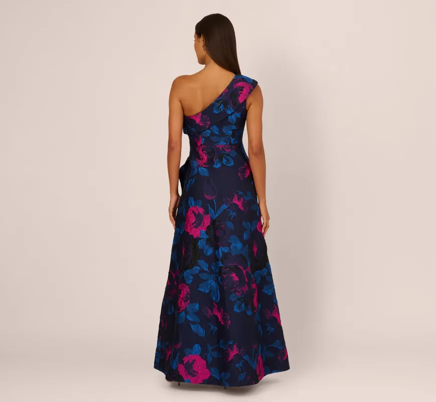 One Shoulder Floral Jacquard A Line Gown In Navy Orchid sold by Adrianna Papell
