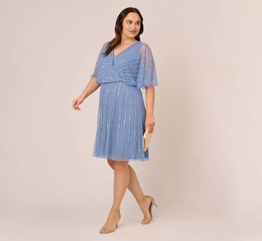 Plus Size Hand Beaded Illusion Faux Wrap Short Cocktail Dress In French Blue sold by Adrianna Papell