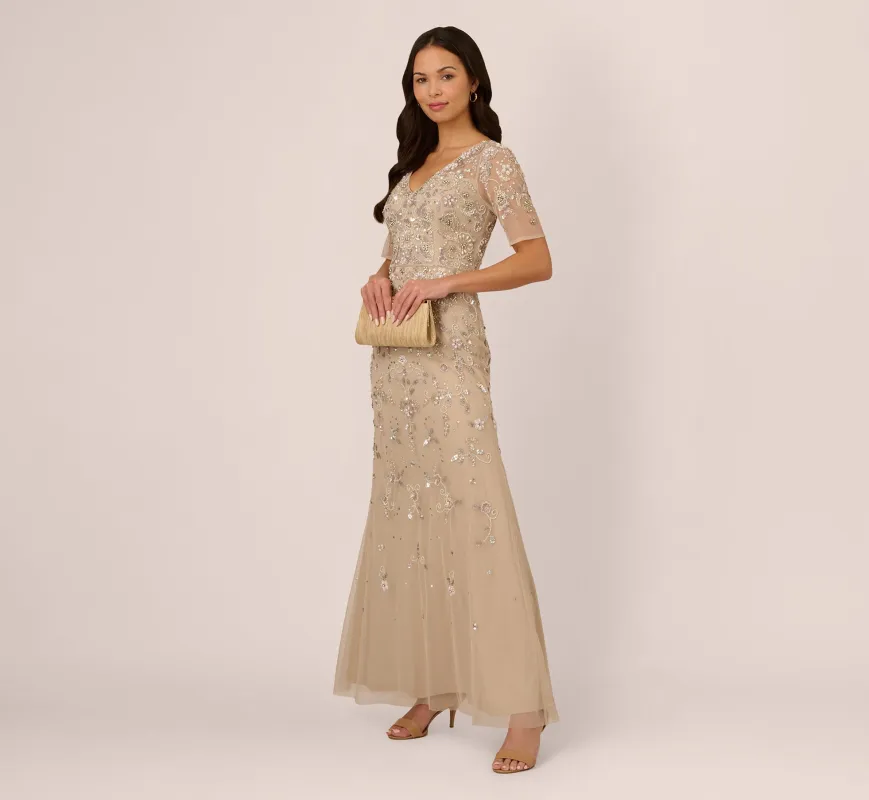 3D Floral Beaded Mermaid Gown With Sheer Short Sleeves In Biscotti sold by Adrianna Papell