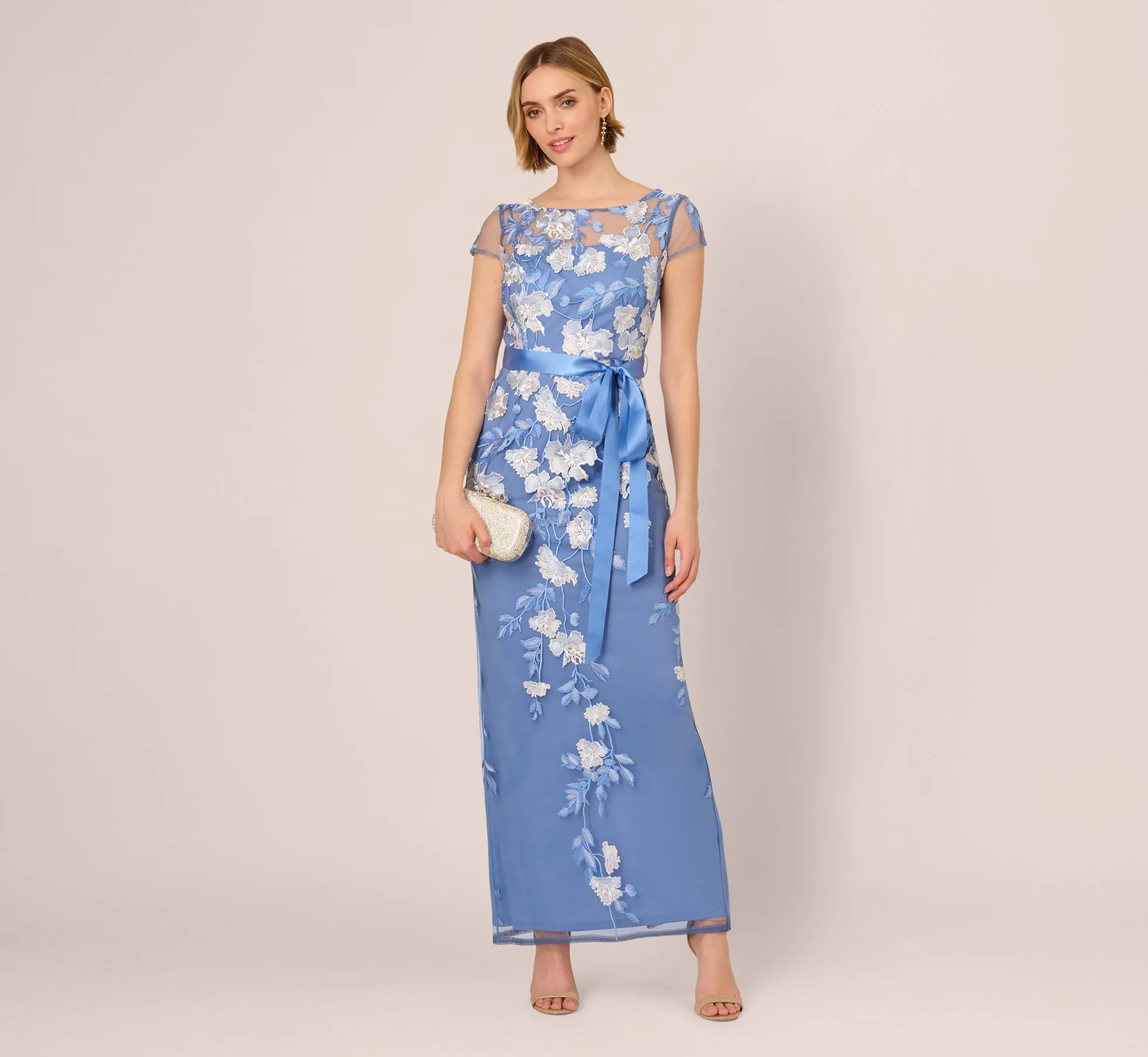 Short Sleeve Floral Embroidered Gown With Ribbon Tie Waist In French Blue Multi sold by Adrianna Papell