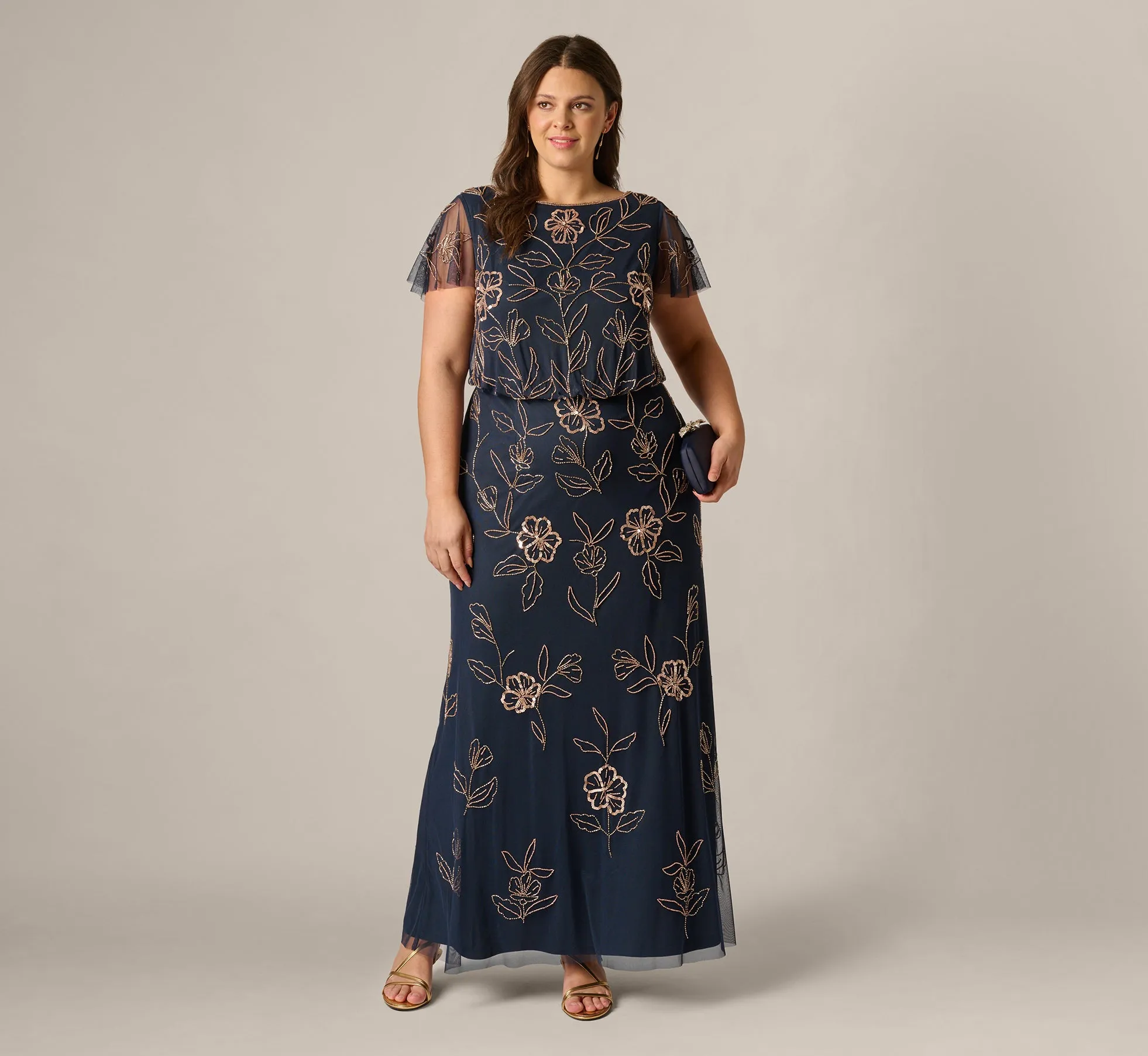 Plus Size Flutter Sleeve Floral Beaded Blouson Gown In Navy Rosegold sold by Adrianna Papell