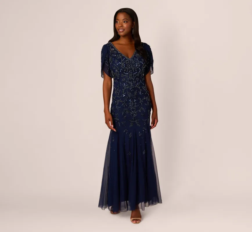Beaded Mermaid Gown With Sheer Petal Sleeves In Light Navy sold by Adrianna Papell