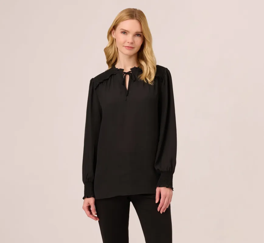 Ruffle Tie Neck Top With Smocked Long Sleeves In Black sold by Adrianna Papell