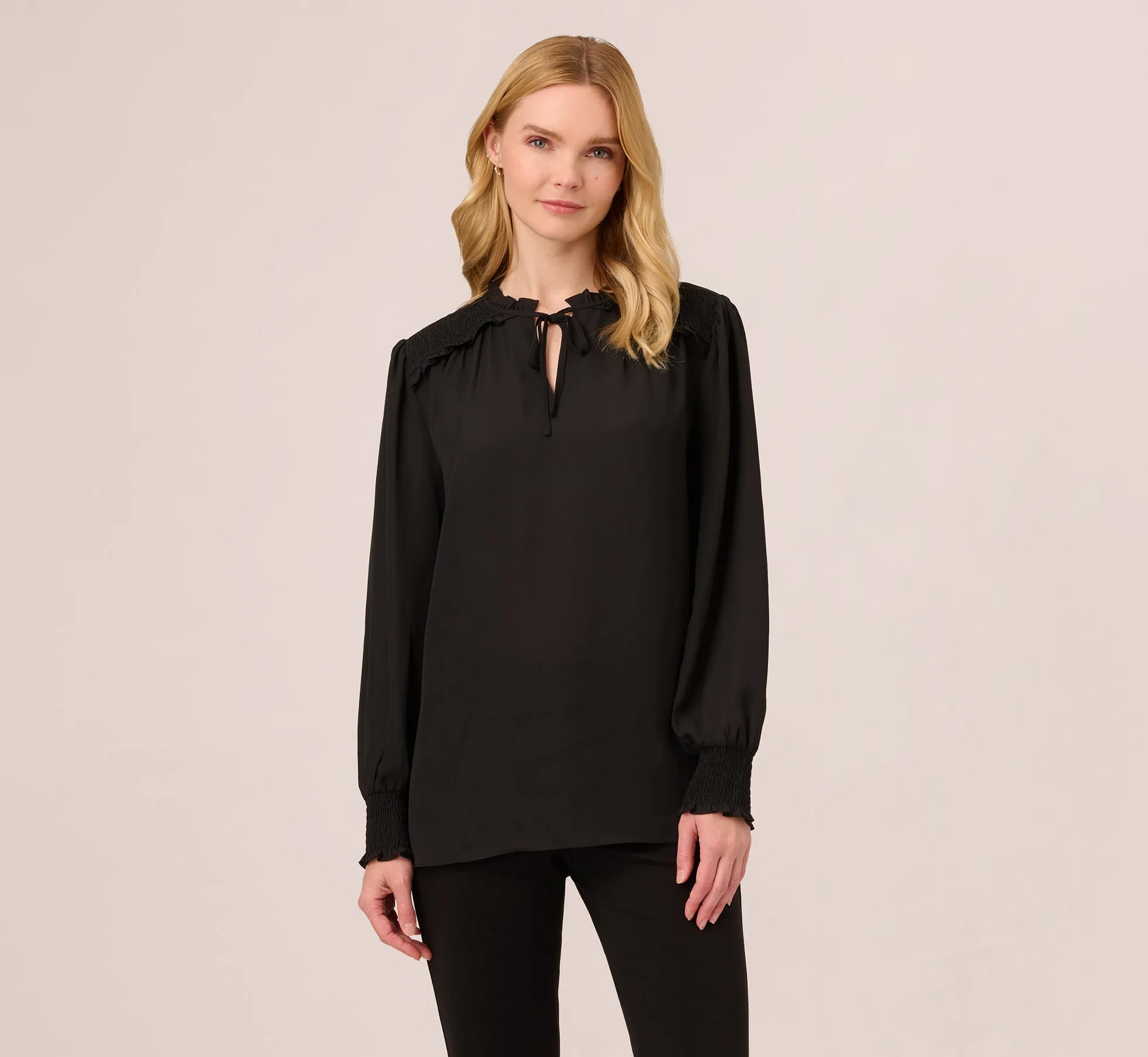 Ruffle Tie Neck Top With Smocked Long Sleeves In Black sold by Adrianna Papell