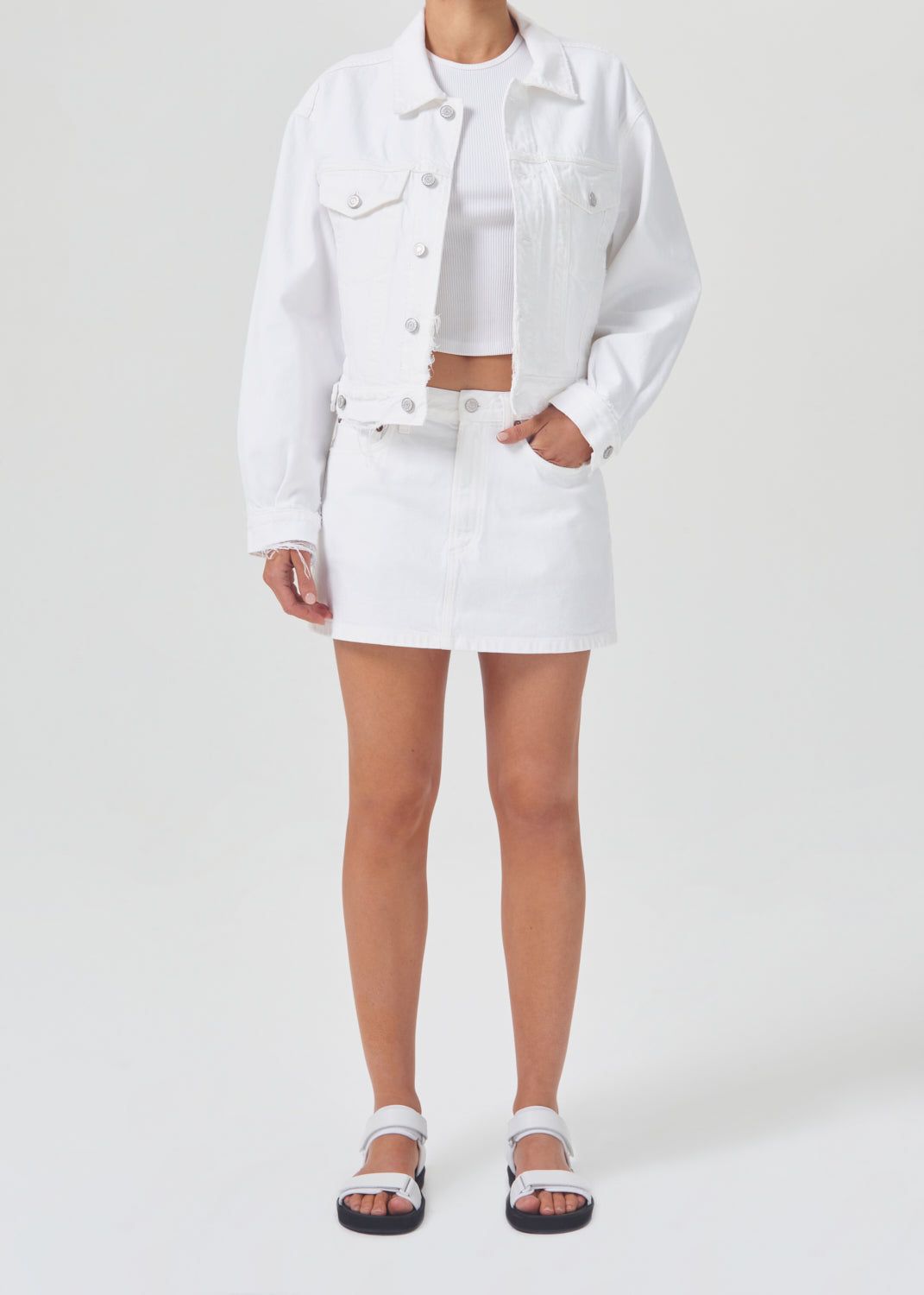 Liv Mini Skirt in Milkshake sold by Agolde