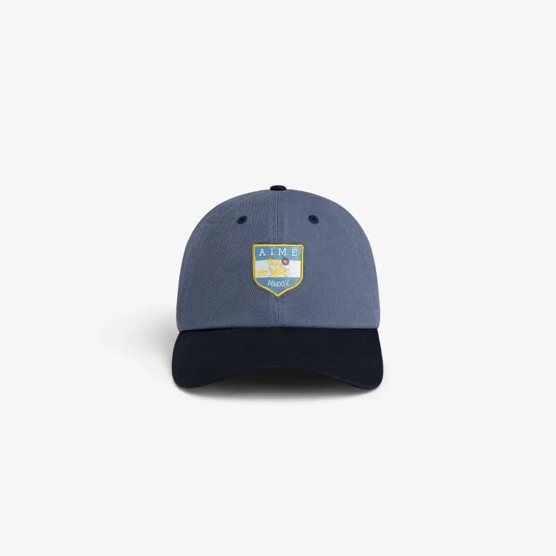 Crest Shield Hat made by Aime Leon Dore