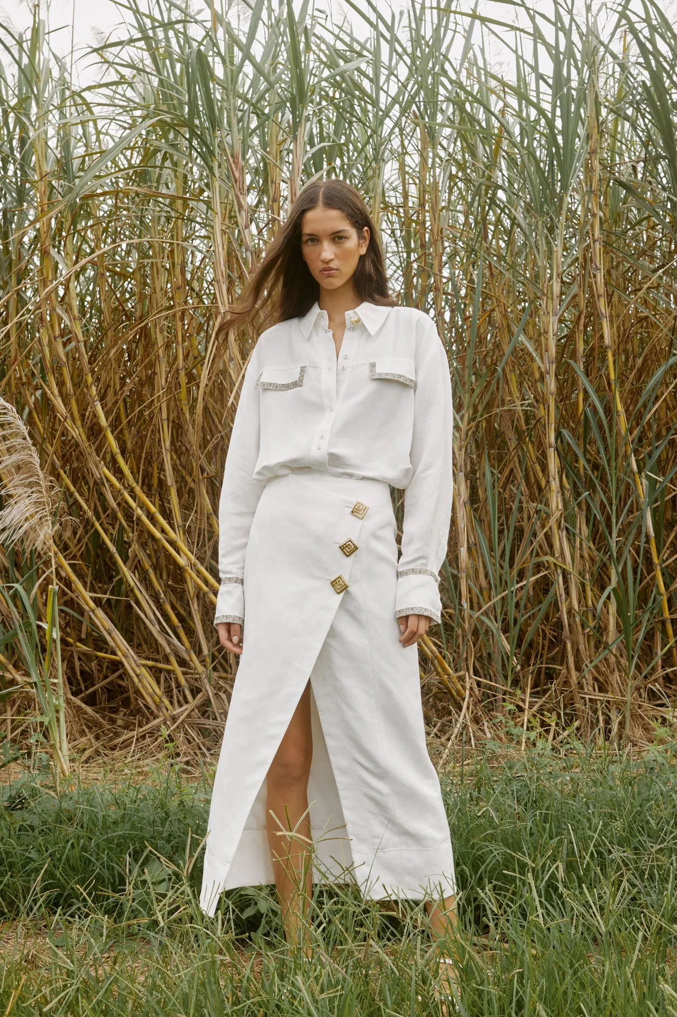 Araminta Wrap Front Midi Skirt sold by Aje