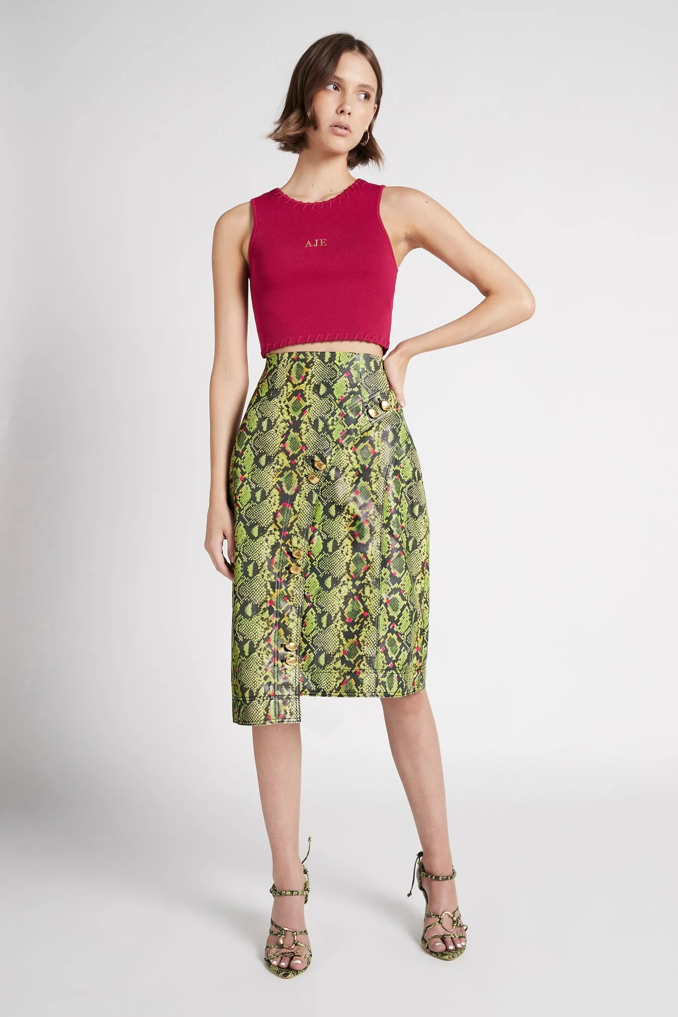 Serpentine Vegan Leather Midi Skirt sold by Aje