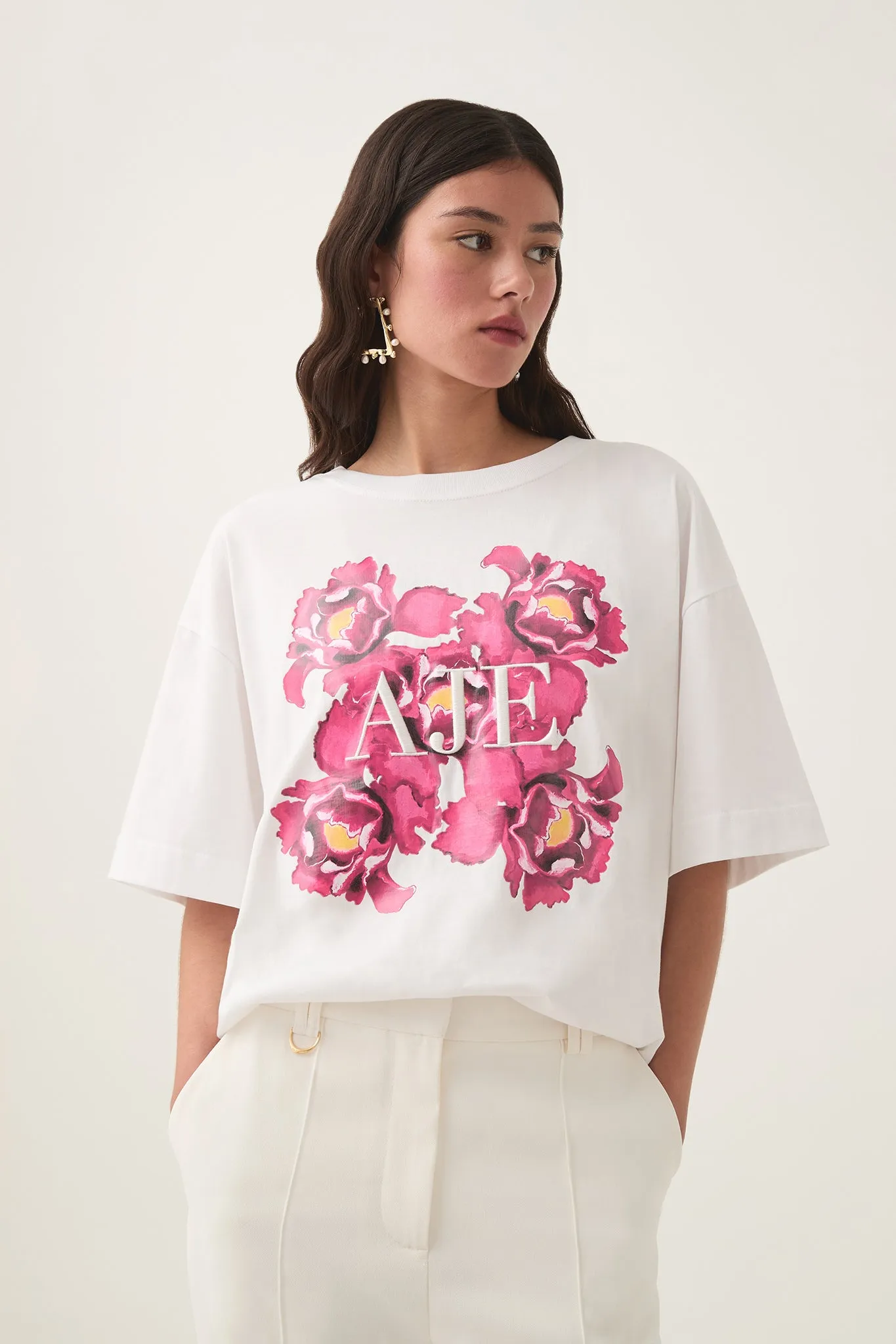 Hypnosis Logo Tee sold by Aje