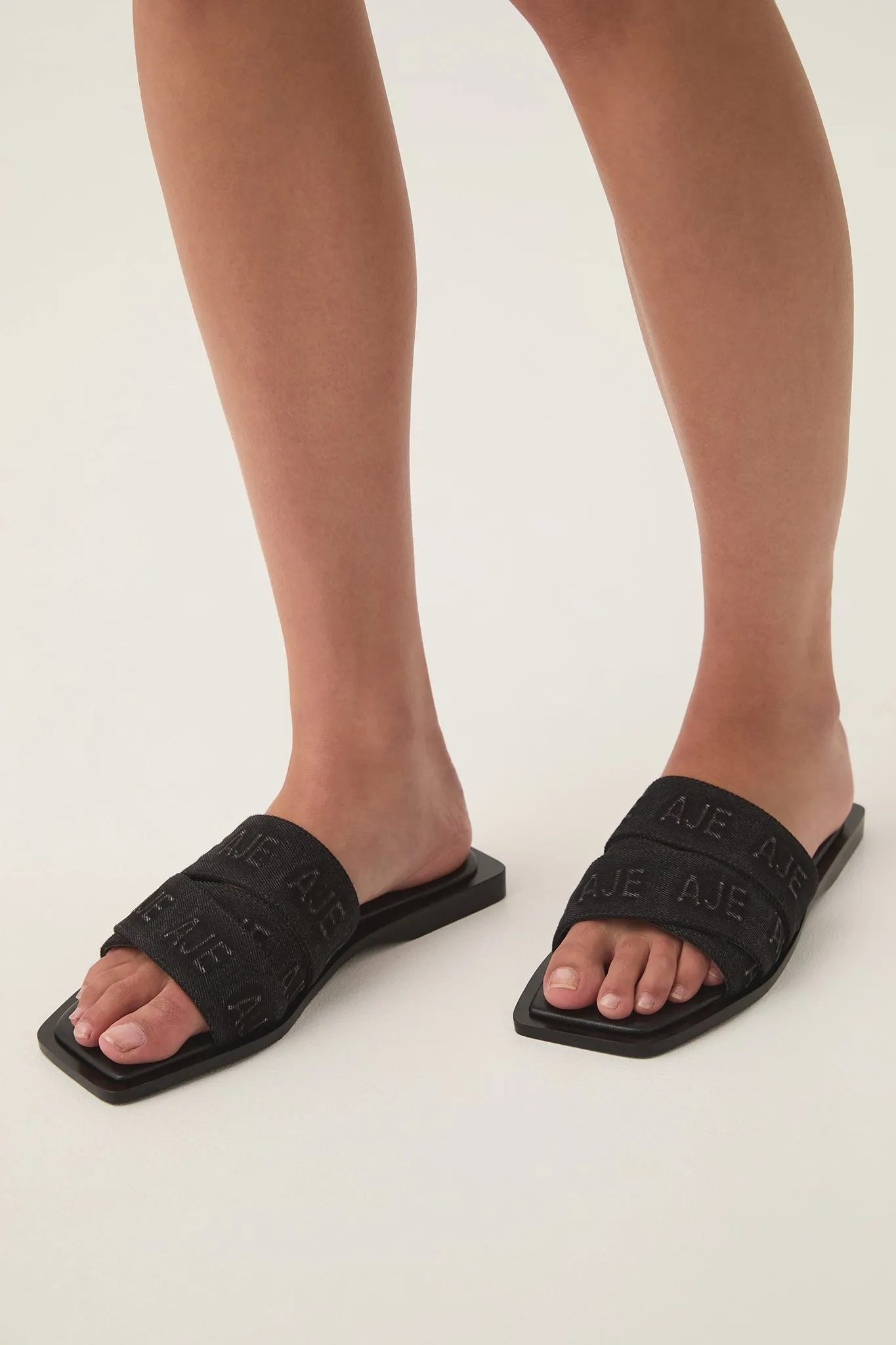 Rita Denim Logo Slide sold by Aje