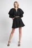 Gazelle Mini Skirt sold by Aje