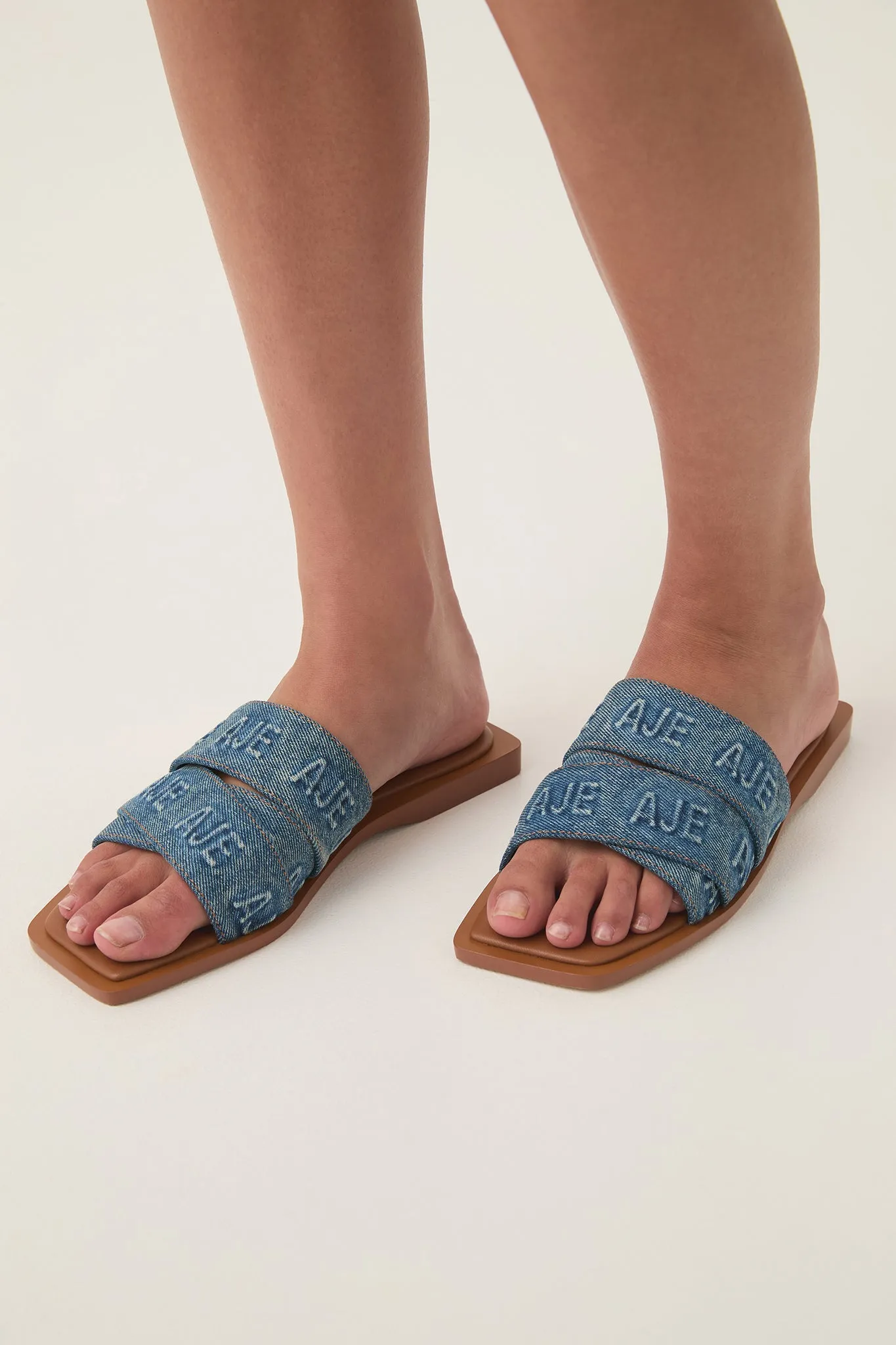 Rita Denim Logo Slide sold by Aje