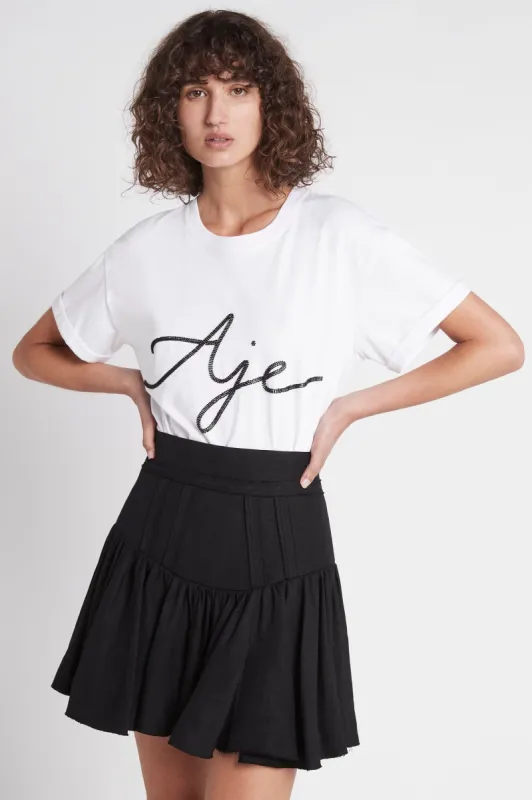 Reverb Flip Mini Skirt sold by Aje