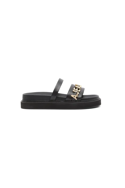 Lucia Logo Platform Slide sold by Aje