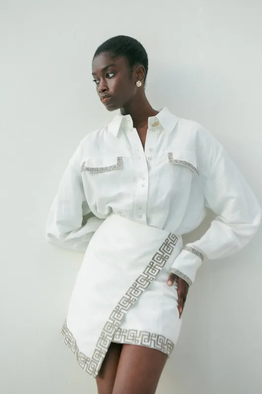 Voyager Embroidered Mini Skirt sold by Aje