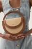Norma Woven Crescent Clutch sold by Aje