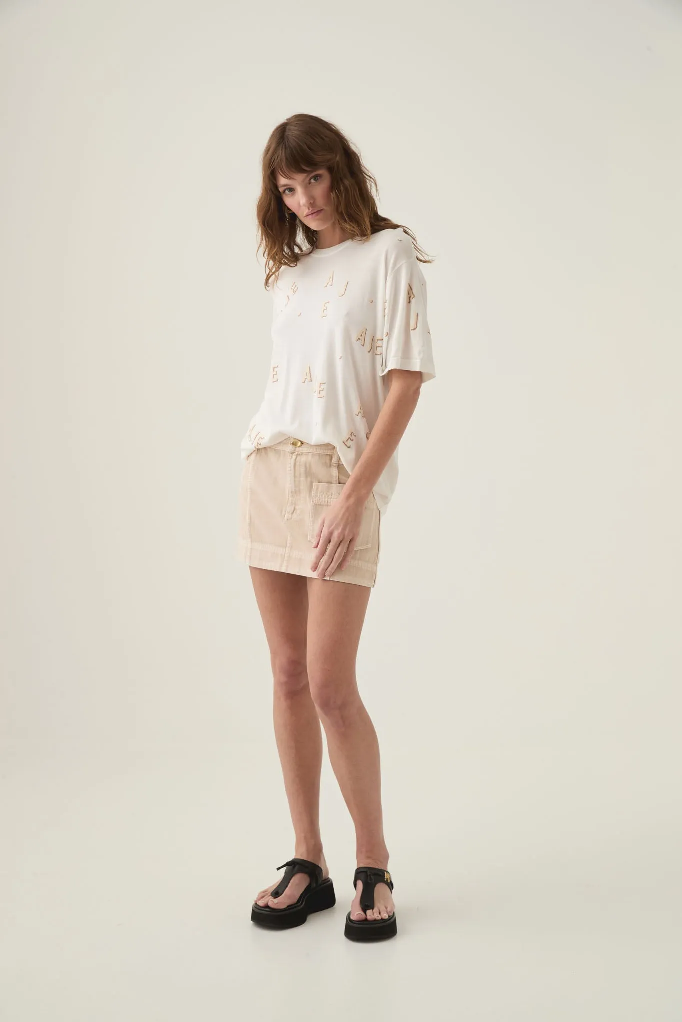 Decora Logo Sprinkle Knit Tee sold by Aje