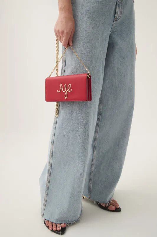 Joni Logo Chain Clutch sold by Aje