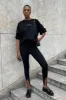 Stirrup Leggings 245 sold by Aje