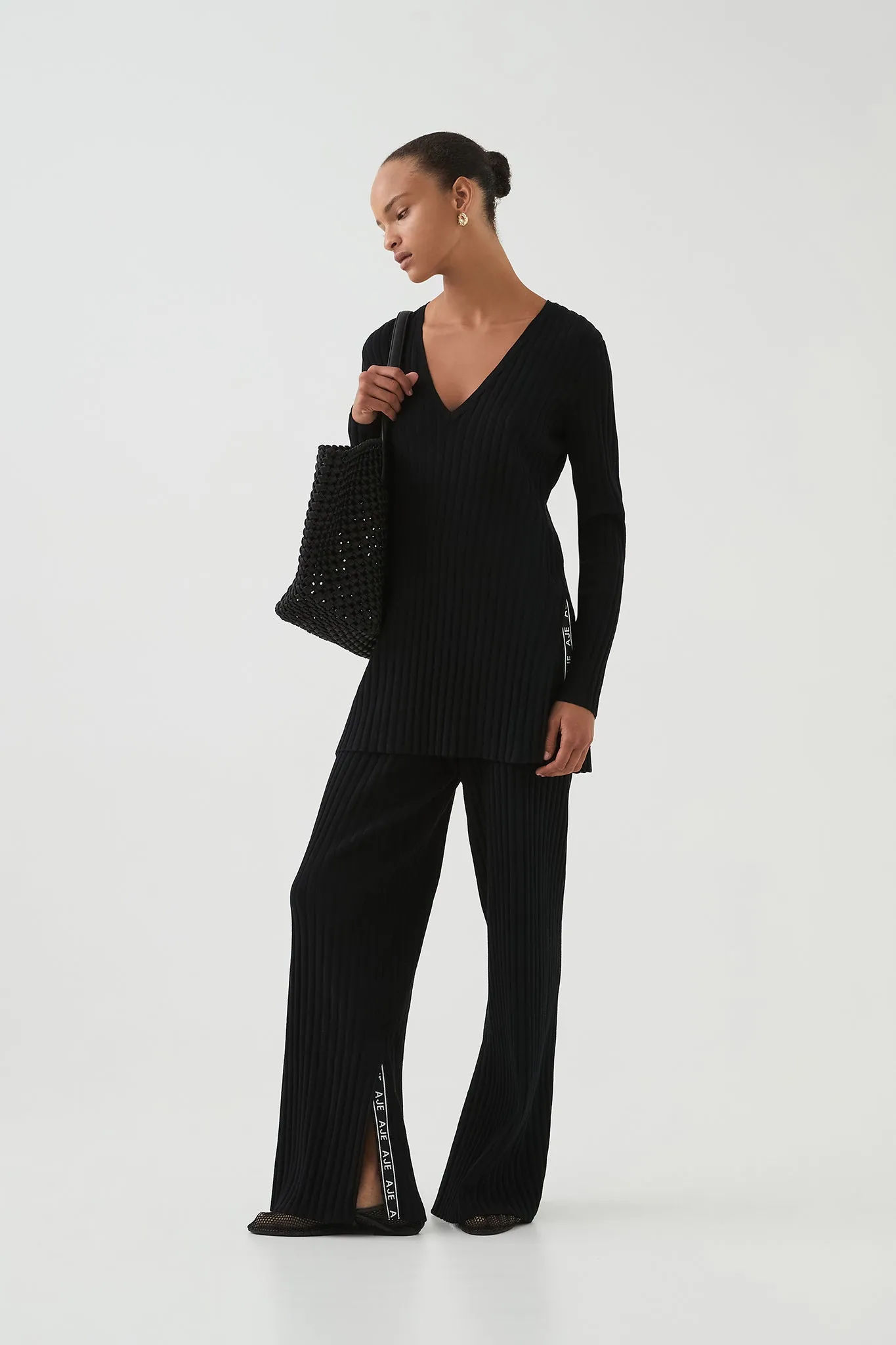 Archer Logo Trim Knit Pant sold by Aje