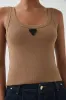 Cowrie Scoop Tank sold by Aje