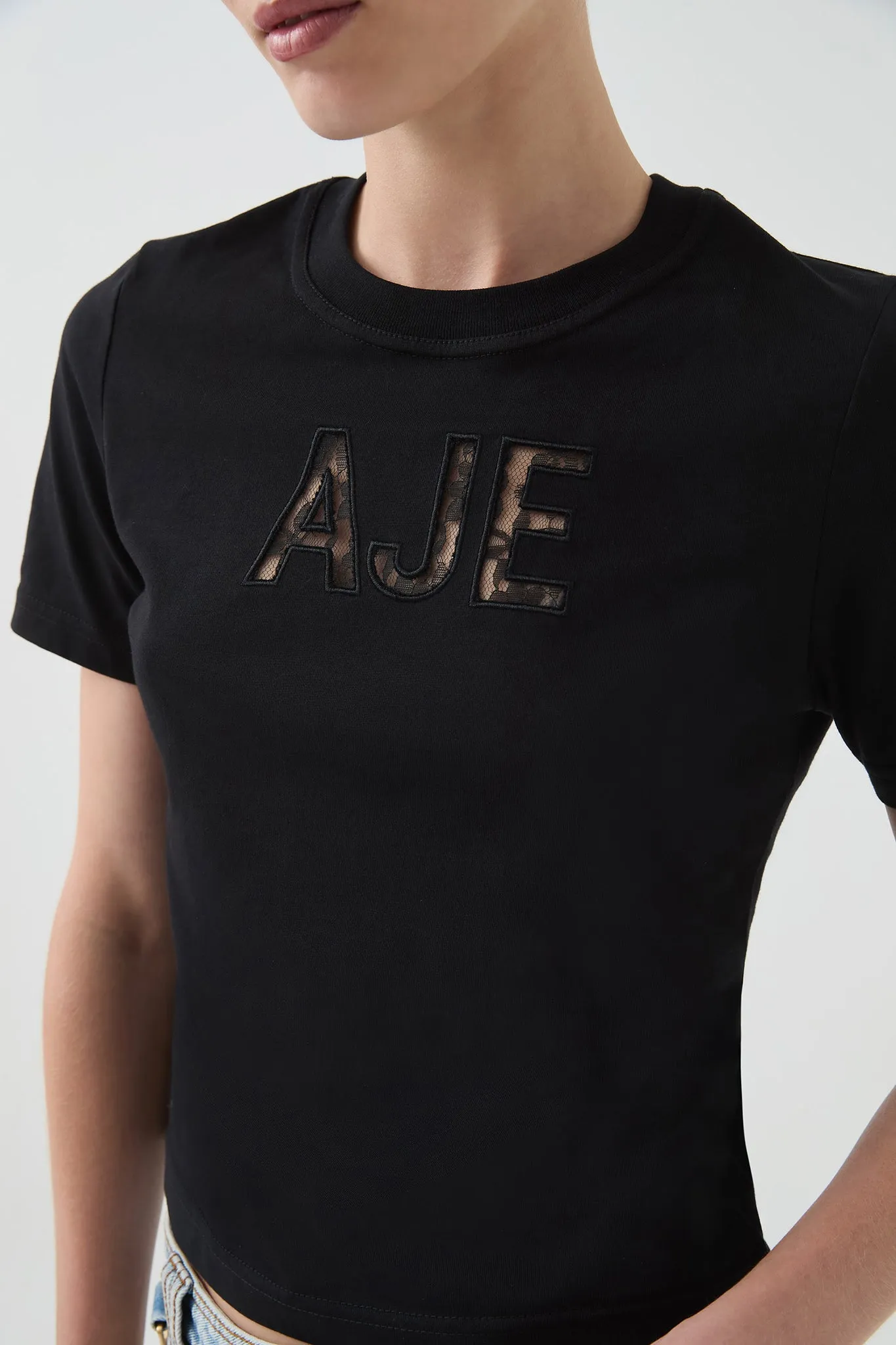 Lee Slim Tee sold by Aje